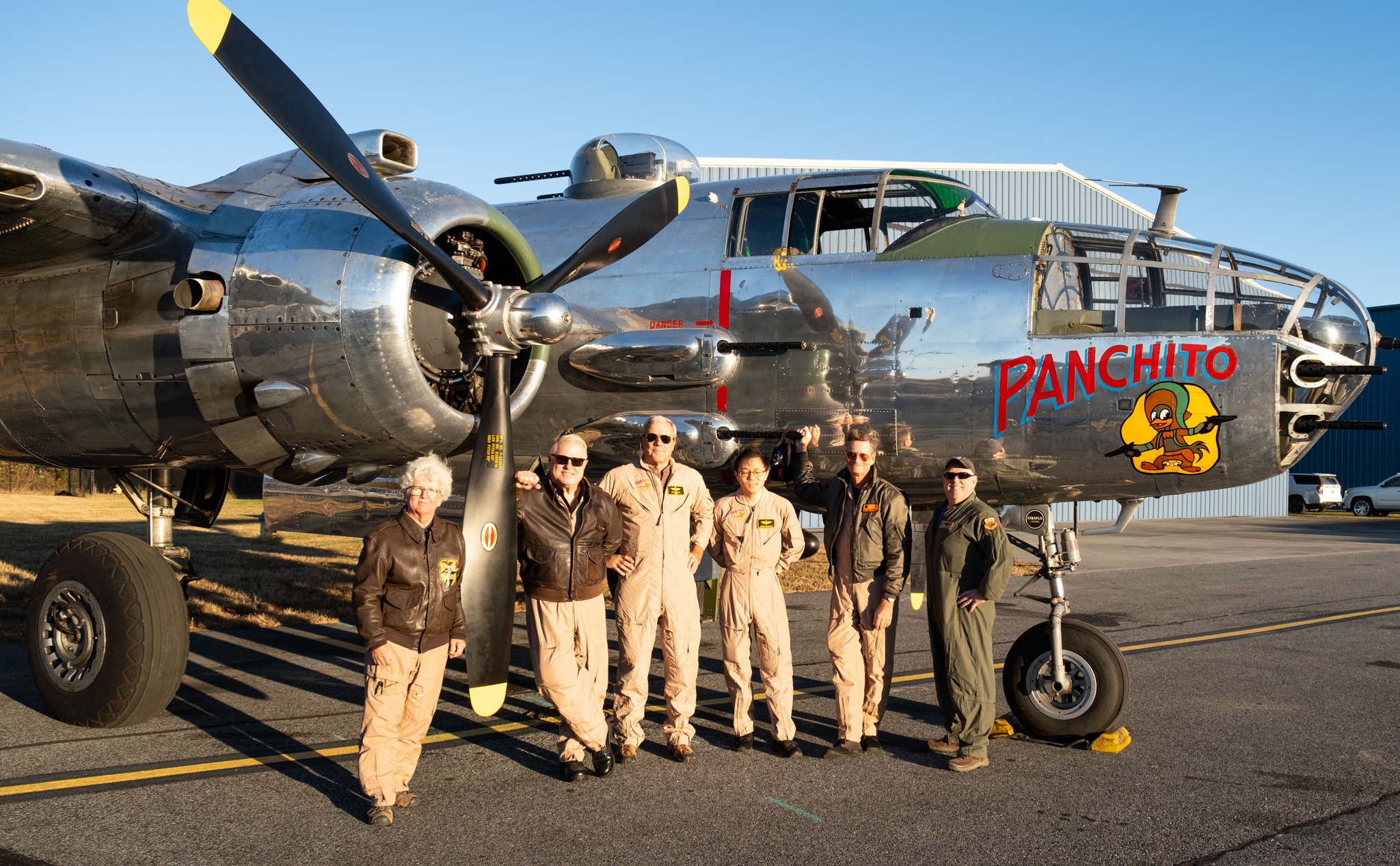 Panchito crew standing in front of aircraft